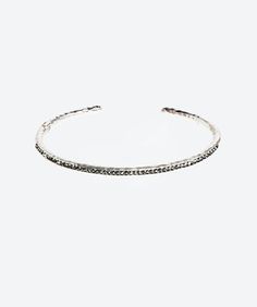 Sophisticated and brilliant crystal tennis bangle, feature a dainty, feminine and unique design. Wear it every day or for a glamorous occasion! Weight: 9 grams Size: 5.7"" circumference Wristband: Includes a hidden hinge for easy slide on and off Materials: SwarovskiTM crystals Precious base Metal: .925 Sterling Silver Texture: Hand hammered Sterling Finish: Gold: 24K Gold dipped Dark: Oxidized and/or Black Rhodium dipped Silver Texture, Gallery Jewelry, Rose Gold Bangle, Gold Dipped, Fine Jewels, Black Rhodium, Slide On, Silver Bangles, Silver Roses