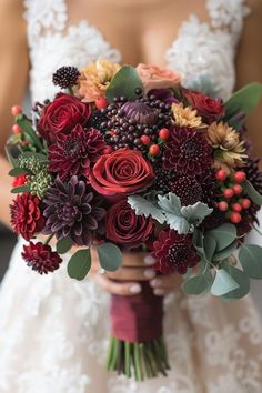 a bride holding a bouquet of flowers in her hands