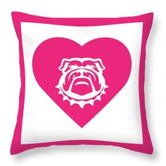 a pink and white pillow with a bulldog's head in the shape of a heart