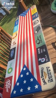 an american flag made out of skateboards on a wooden deck with text overlaying the image