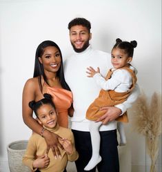 a man, woman and child posing for a photo