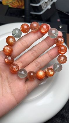 Material:  Arusha sunstone beads  size :  12mm hole size 1mm   quantity: one strand  6mm approx 29 pcs one strands 7mm approx25 pcs one strands 8mm approx 22 pcs one strands 9mm approx 21pcs one strands 10mm approx 19 pcs one strands 11mm approx 18pcs one strands 12mm approx 16 pcs one strands 13mm approx 16 pcs one strands 14mm approx 15 pcs one strands 15mm approx 14pcs one strands 16mm approx 14 pcs one strands 17mm approx 13pcs one strands 18mm approx 13pcs one strands 19mm approx 12pcs one Orange Beaded Bracelets With 8mm Round Beads, Orange Beaded Bracelet With Natural Stones, Orange Polished Beads Bracelet, Orange Gemstone Beads Crystal Bracelet As Gift, Orange Crystal Bracelet With Gemstone Beads As Gift, Amber Gemstone Beaded Bracelets, Amber Gemstone Beads Bracelet, Healing Crystal Bracelet With Spacer Beads, Orange Crystal Bracelet As Gift