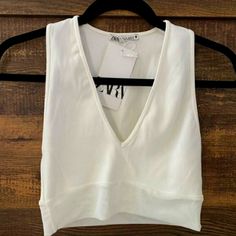 Nwt Ribbed Crop Top With Mesh By Zara. V Neck Crop Top In Ribbed Material With Mesh Bottom. There Is A Small Pinch Where The Security Tag Was Improperly Placed, Shown In The Image. 93% Polyamide, 7% Elastane.