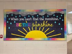 there is a large poster on the wall in this hallway that says, when you can't find the sunshine, be the sunshine