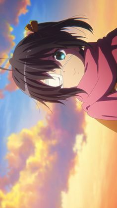 an anime character with long black hair standing in front of a sunset sky and clouds