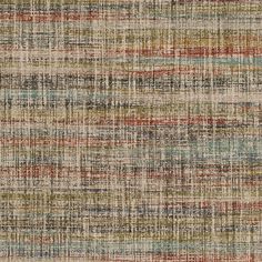 a multicolored area rug with different colors and patterns on the carpet, including stripes