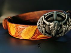 Leather Indian Belt With Bull Skull Buckle is made entirely by hand of vegetable tanned leather 4 mm thick. Belt width 3.8 cm. The picture is made in the combined technique of pyrography and carving on leather. Leather Mens Belt is dyed after the drawing. For our work we use only professional paints for leather of American manufacture. Before finishing lacquering, this womens belt is treated with special oils, which give the leather elasticity and prevent the appearance of cracks in the picture. Custom Engraved Leather Belt Buckles, Artisan Handmade Leather Belt Buckles, Handmade Artisan Leather Belt Buckles, Traditional Hand Tooled Leather Belt Buckles, Handmade Leather Belt Buckles In Brown, Handmade Brown Leather Belt Buckles, Product Aesthetic, Thick Belt, Womens Belt