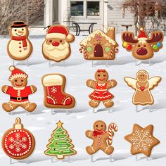 a collection of gingerbread cutouts in the snow