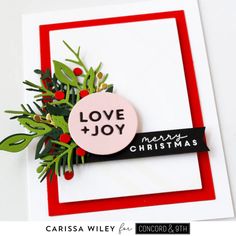 a christmas card with the words love and joy on it, surrounded by holly branches