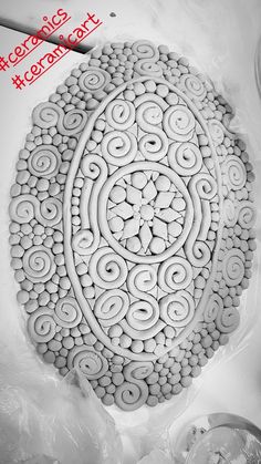 an intricately designed design is shown in black and white