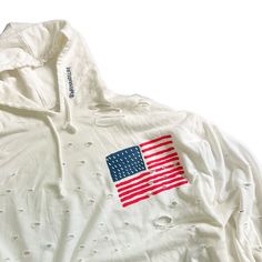 DESCRIPTION EACH PIECE IS MADE TO ORDER, HAND PAINTED BY GLORIA AND HER TEAM IN THEIR NYC STUDIO PRODUCT DESCRIPTION The perfect oversized white distressed hoodie. American flag painted on front chest, with USA painted on back in red, with blue outline. Signed @wrenandglory Due to each piece being hand painted, each piece might have slight differences. Limited edition. FIT Oversized, Super Comfy, Slouchy fit. Can be worn as a sweater or dress. One size fits most Measurements: Body Width 27", Len White Distressed Casual Sweatshirt, White Distressed Sweatshirt For Fall, Spring Distressed Long Sleeve Hoodie, Distressed Cotton Hooded Tops, White Distressed Sweatshirt, White Distressed Long Sleeve Sweatshirt, Distressed White Long Sleeve Top, Oversized Distressed White Top, Distressed White Tops For Fall