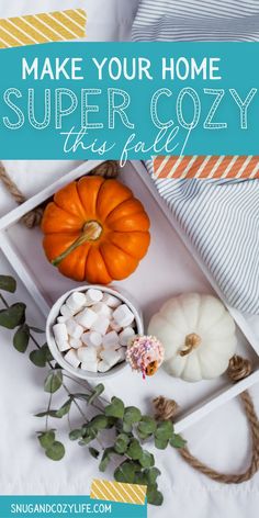 a tray filled with marshmallows and pumpkins on top of a bed