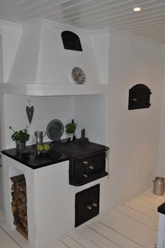 a kitchen with an oven, stove and counter top in the middle of it's room