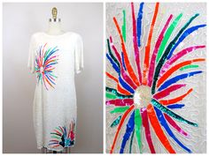 "This is such a unique vintage dress. It's hand embellished with white beading and accented with neon sequins. It's in perfect condition! Bust - 40\" Waist - 34\" Hips - 42\" Length - 39\" This dress comes from a pet-free and smoke-free home. If you would like more info or have any questions, please don't hesitate to ask!"