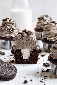 chocolate cupcakes with frosting and oreo cookies