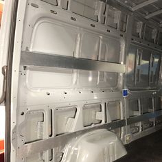 the interior of an empty van with no doors