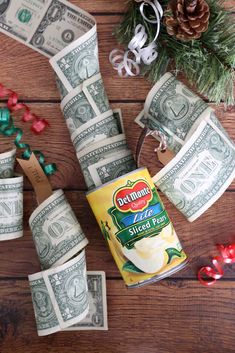 dollar bills and christmas decorations on a wooden table