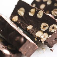 some pieces of chocolate with nuts on top