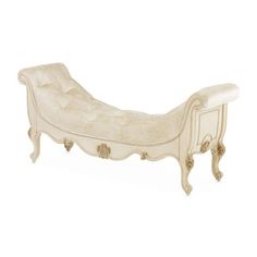 an antique white chaise lounger on display