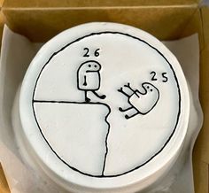 a white cake with a drawing on it