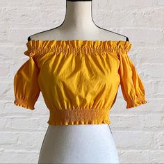 H&M Yellow Cropped Off Shoulder Ruffled Blouse Boho Style Top In Woven Cotton Fabric With Eyelet Embroidery. Short Sleeves With Smocked Trim And Smocking At Top And At Hem. Nwt Elastic Stretch Measurements Chest 15” Bust 30” Length 15” Discounts Offered On Bundles Of 2+ Posh Ambassador- Suggested User Fast Shipping Top Rated - 5 Seller Chic Yellow Cotton Crop Top, Yellow Ruffled Top For Brunch, Chic Yellow Crop Top For Day Out, Fitted Yellow Ruffle Blouse, Chic Yellow Off-shoulder Tops, Casual Yellow Off-shoulder Top, Yellow Short Sleeve Summer Crop Top, Chic Yellow Short Sleeve Crop Top, Chic Cropped Yellow Tops