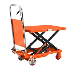 an orange scissor is sitting on top of a white table and it's wheels are down