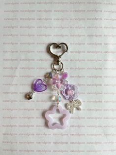 ⋆ ˚｡⋆୨୧˚ Handmade Purple inspired Keychains (an original design) ˚୨୧⋆｡˚ ⋆  -`♡'- Made with acrylic beads, glass beads, metal charm, lobster clasp, and acrylic charm pendant. -`♡'-  Measured at a little over 4 inches (Keychain Clasp is included and measured at 1 1/2 inches). Each keychain weighs 0.3 oz! ⋆.ೃ࿔*:･ Care Instructions ⋆.ೃ࿔*:･ - Avoid moisture, perfumes, oils, and water. Avoid snagging and tugging, use the provided cloth if discoloring or tarnishing occurs, works on jewelry as well! Keychains can be delicate! Please follow care instructions to ensure longevity. ⋆.ೃ࿔*:･  Shipping Details ⋆.ೃ࿔*:･ - No returns or exchanges!  - Estimated shipping processing time is 2-3 weeks. - Not responsible after shipping! Ownership and Usage Terms All content, including product descriptions and im Trendy Handmade Keychains For Gifts, Pink Beaded Craft Supplies For Gifts, Cute Handmade Craft Supplies For Personal Use, Customized Pink Keychains As Gifts, Customized Pink Keychain As Gift, Customized Pink Keychain For Gift, Purple Handmade Craft Supplies For Gifts, Cute Purple Craft Supplies For Gifts, Handmade Purple Craft Supplies For Crafting