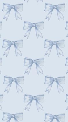 a blue and white bow pattern on a light blue background with watercolor paint effect