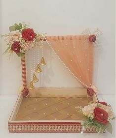 a decorative box with flowers and decorations on it