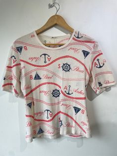 Vintage Nautical Terrycloth T-Shirt. Cutest little tee with ropes, anchors, boats and more printed throughout. Fits XS/S, wash on gentle and tumblr dry. Some wear throughout! Approximate measurements: Underarm to underarm: 18"Length: 22" Nautical Clothing, Nautical Style, Vintage Nautical, Nautical Fashion, Terry Cloth, Anchors, Etsy Vintage, Boats, Nautical