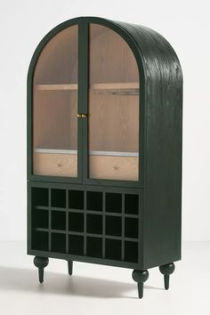 a black cabinet with glass doors and wooden shelves