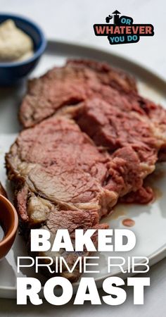 baked prime rib roast on a plate with dipping sauce