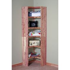 a wooden shelf with several items on it in a room that has carpet and walls