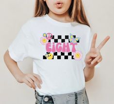 ..♥....♥..Your little one will love her special groovy eight birthday shirt!!...♥....♥..  Perfect for the Barbie birthday theme! ..♥..Youth unisex fit Jersey Short-Sleeve T-Shirt..♥.. Available sizes: S(6/8) M(10/12) L(14/16) XL(18) ..♥..Prefer a different COLOR.  No problem.  Just ask..♥.. D E T A I L S Pre-shrunk fabric Solid Colors: 100% combed and ring-spun cotton Heather Colors: 52% ring-spun cotton, 48% polyester Athletic and Black Heather: 90% ring-spun cotton, 10% polyester This is a direct to garment print, no vinyl or stencils. Machine wash cold, inside-out, gentle cycle with mild detergent and similar colors. No fabric softeners. Tumble dry low, or hang-dry for longest life. Cool iron inside-out if necessary, do not iron decoration. Do not dry clean. S H I P P I N G Shirts are m Trendy Birthday T-shirt For Spring, Trendy T-shirt For Spring Birthday, Seven Birthday Shirt, Barbie Birthday Theme, Girls 8th Birthday, Eight Birthday, Girls 9th Birthday, Girls Birthday Shirt, Groovy Birthday