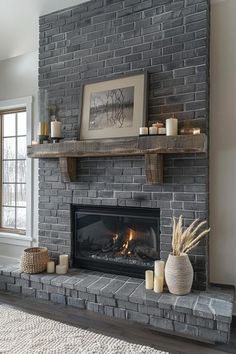 a living room with a fire place and candles