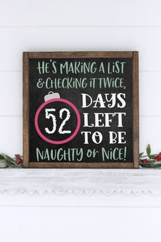 a sign that says he's making a list and checking it twice days left to be naught or nice