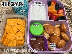 the lunch box is filled with different types of snacks, including crackers and fruit