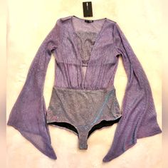 Please See Photos For Measurements. Any Questions On Measurements Please Feel Free To Inquire. Unattached Tube Top That Zips On The Back Side. Glitter And Shimmer! Is In New With Tags Condition. Glamorous V-neck Stretch Bodysuit, Glamorous Long Sleeve Bodysuit For Spring, Purple One-piece Bodysuit For Party, Glamorous Long Sleeve Bodysuit For Summer, Spring Party Purple Bodysuit, Purple Stretch Bodysuit For Night Out, Purple Bodysuit For Summer Nights, Trendy Purple Bodysuit For Party, Purple Summer Bodysuit For Night Out