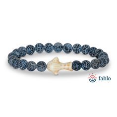 a bracelet made out of blue and white beads with a bone in the middle on a white background