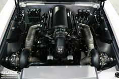 the engine compartment of a sports car is shown