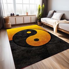 a living room with a couch and rug in the shape of a yin - yang symbol