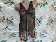 90s Vintage Womens Black Lace Fringed Bolero Sleeveless. Size XXS-XS. Bolero is in excellent vintage condition. Bust 70cm (27.5in), Sleeve 61cm (24in), Length without fringe 54cm (21in), with fringe 74cm (29in). Black Sleeveless Festival Vest, Bohemian Sleeveless Tank Top For Party, Black Stretch Vest For The Beach, Black Sleeveless Tank Top For Festival, Vintage Party Vest For Summer, Vintage Summer Party Vest, Shrugs And Boleros, Botanical Pattern, 90s Vintage