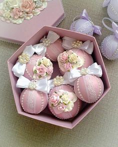 there are many pink decorated eggs in the box