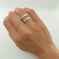 Introducing the exquisite Multi Color Eternity Thick Band in 14K Yellow Gold—a true masterpiece that effortlessly combines luxury, craftsmanship, and captivating aesthetics. Handcrafted in the heart of Italy, this wide band ring is a symbol of timeless beauty and sophistication.14K Yellow Gold 9.3mm thick Multi color zirconia Size 4.5 / 5.5 Thank you for visiting our shop!Visit our website DmKJewelry.comAlso Follow us on Instagram https://www.instagram.com/dmkjewelry_/ Fine Jewelry Wide Band Open Ring, Wide Band Promise Rings In Fine Jewelry Style, Yellow Gold Wide Band Jewelry With Gemstone, Yellow Gold Jewelry With Gemstone In Wide Band, Fine Jewelry Anniversary Wide Band Open Ring, Fine Jewelry Wide Band Open Ring For Anniversary, Fine Jewelry Wide Band Ring For Anniversary, Luxury Wide Band Open Ring For Anniversary, Anniversary Fine Jewelry Open Band Wide Ring