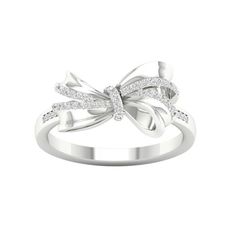 Modern and stylish, this diamond knot ring pairs well with casual attire and party wear. Crafted in 10K white gold, this ring features a diamond accent ribbon wrapped into a knot. Prong set with round diamonds totalling 0.12Ct TDW, this ring captivates with diamond shimmer and polished metallic lustre. Size: 7. Gender: female. Age Group: adult. Diamond Knot Ring, Gold Knot Ring, Diamond Knot, Diy Jewelry Rings, Rope Rings, Raw Stone Ring, Gold Filled Ring, Knot Ring, Casual Attire