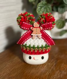 a small christmas ornament is sitting on a table