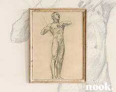 a drawing of a man is hanging on the wall