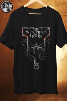 t-shirt with art nouveau drawing of a woman with lanterns and text "the witching hour" Graphic Tee Styling, Shirt Branding, T Shirt Outfit Ideas, Tee Styling, T Shirt Trends, T Shirt Quotes, The Witching Hour, Vintage Book Cover, Shirt Inspiration