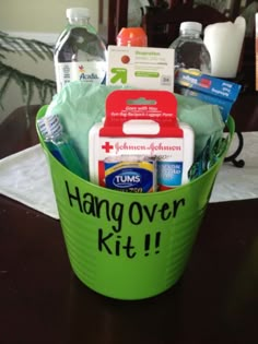 a green bucket filled with items on top of a table