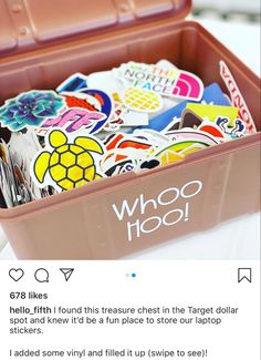 a plastic container filled with lots of stickers